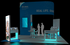 20' x 20' Custom Island Exhibit w/ Architectural Wall and HaloLit Product Kiosks (ID0564)